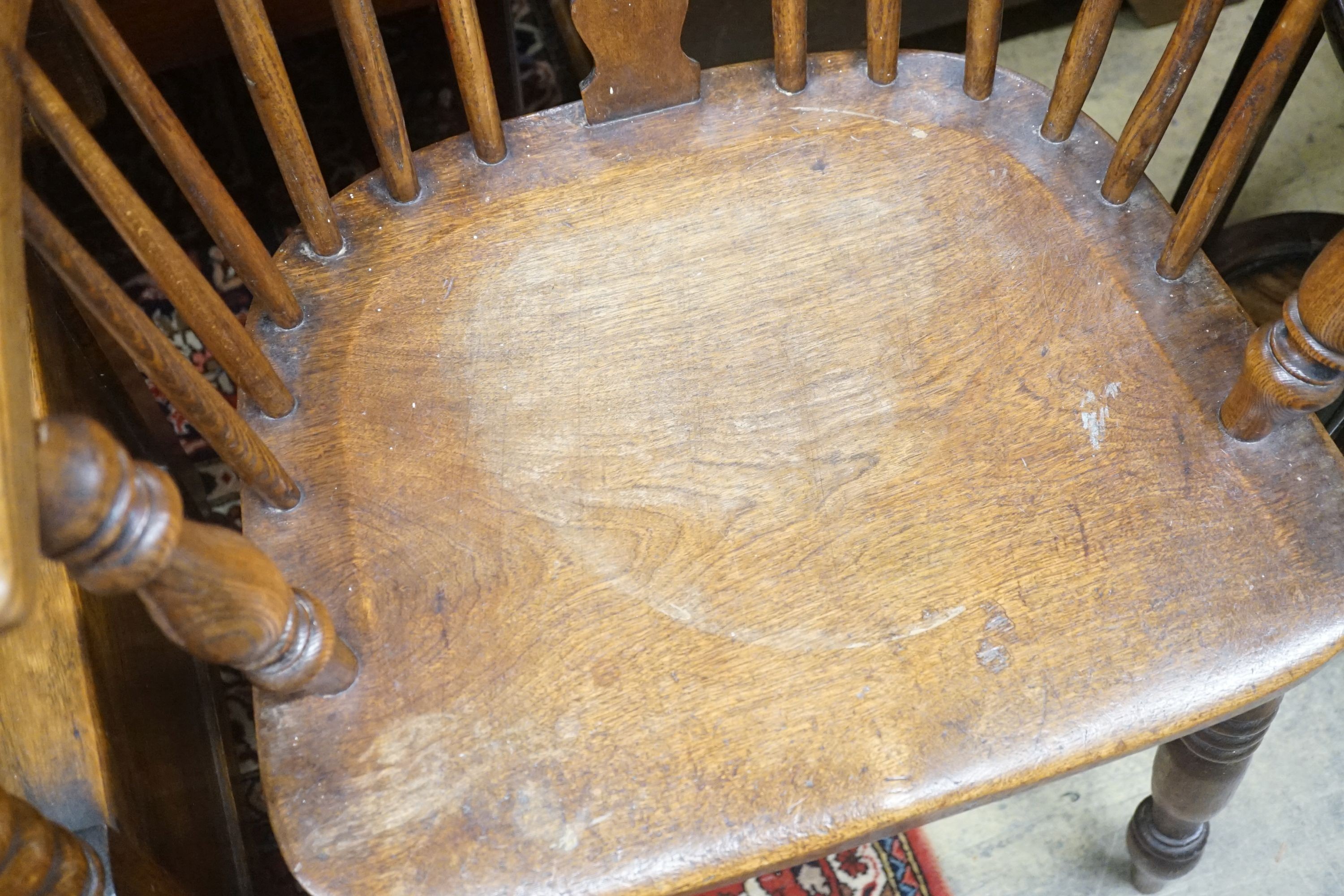 A 19th century Windsor elm and beech armchair, width 58cm depth 46cm height 114cm